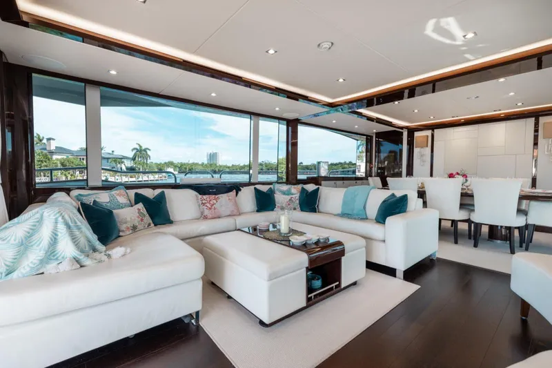 Mirracle Yacht Photos Pics Luxurious interior of 2018 Sunseeker 95 Yacht with elegant seating and panoramic windows.