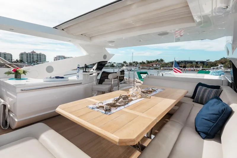 Mirracle Yacht Photos Pics Luxurious 2018 Sunseeker 95 Yacht deck with elegant seating and scenic waterfront view.