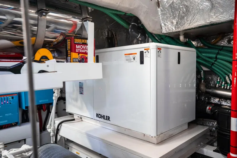 Mirracle Yacht Photos Pics Engine room of 2018 Sunseeker 95 Yacht featuring Kohler generator and equipment.