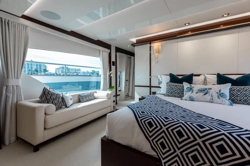 Mirracle Yacht Photos Pics Luxurious interior of 2018 Sunseeker 95 Yacht with elegant bedroom and scenic window view.