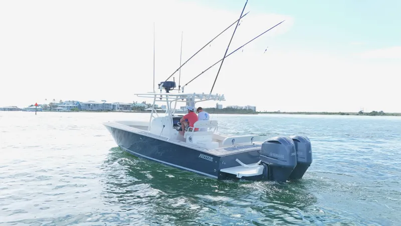 Extremely Clean / Fish Ready Yacht Photos Pics 2004 Jupiter 31 FS boat on calm water with fishing rods and dual engines.