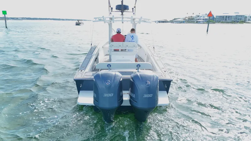 Extremely Clean / Fish Ready Yacht Photos Pics 2004 Jupiter 31 FS boat with dual 300 horsepower engines on open water.