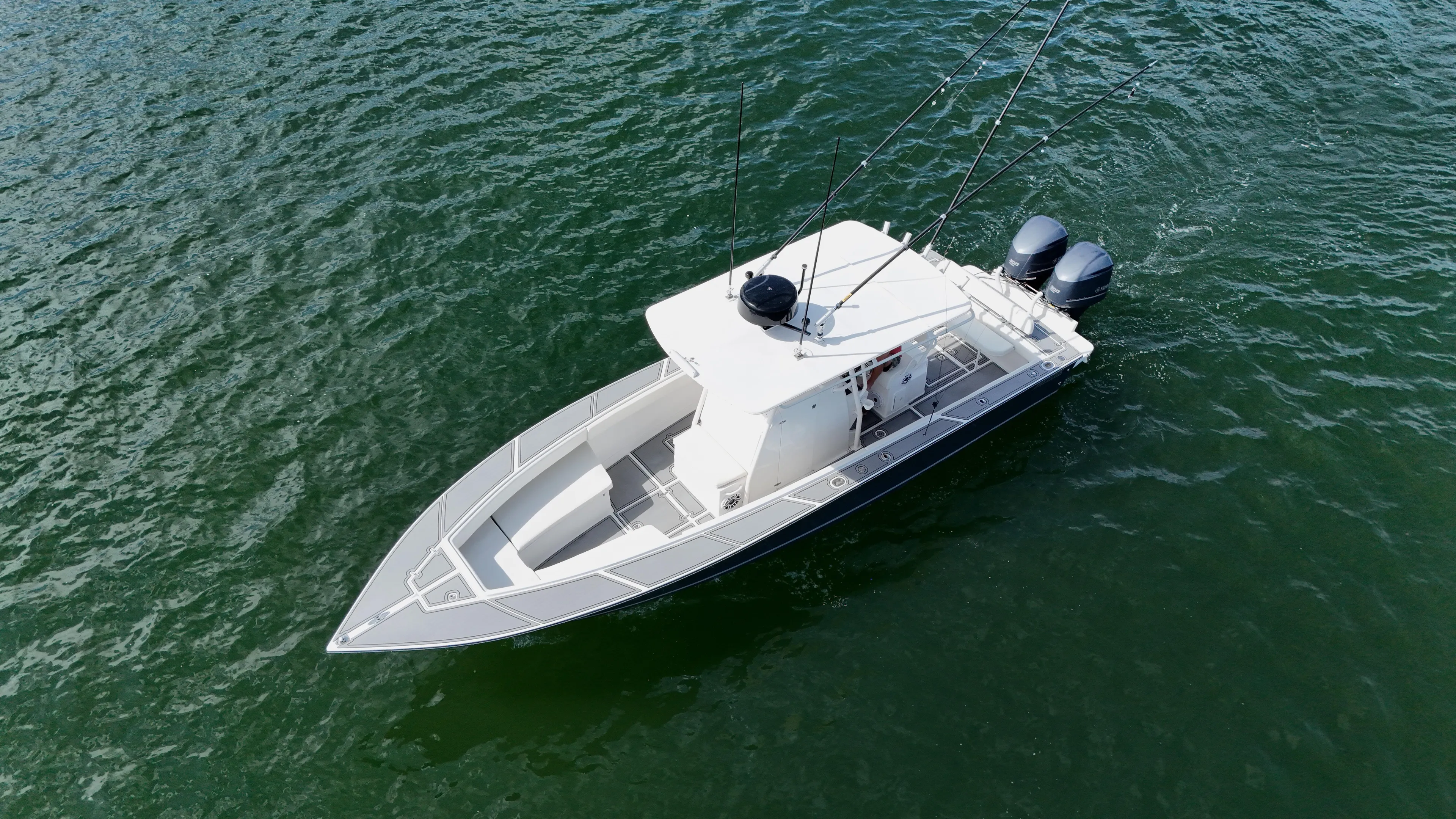 Extremely Clean / Fish Ready Yacht Photos Pics 2004 Jupiter 31 FS boat on open water, aerial view.