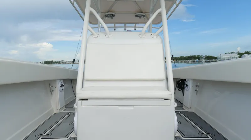 Extremely Clean / Fish Ready Yacht Photos Pics 2004 Jupiter 31 FS boat interior with white seating and open deck view.