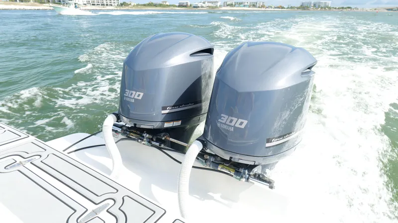 Extremely Clean / Fish Ready Yacht Photos Pics Twin Yamaha 300 outboard engines on a 2004 Jupiter 31 FS boat in motion.