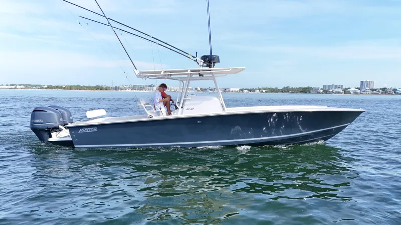 Extremely Clean / Fish Ready Yacht Photos Pics 2004 Jupiter 31 FS boat cruising on open water with fishing rods.