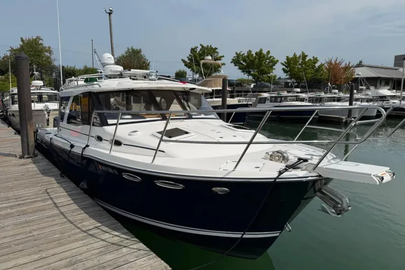  Yacht Photos Pics 2021 Cutwater C-32 Coupe docked at marina, showcasing sleek design and modern features.