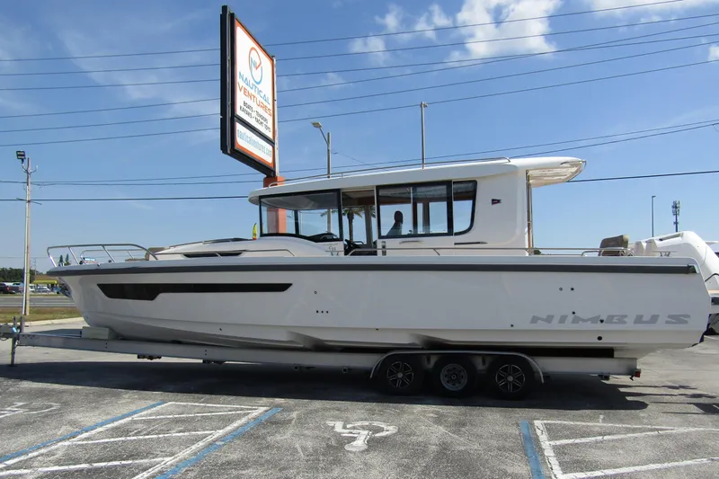  Yacht Photos Pics 2025 Nimbus Commuter 11 boat on trailer at Nautical Ventures dealership.