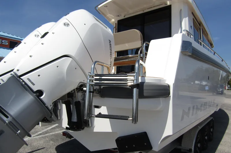  Yacht Photos Pics 2025 Nimbus Commuter 11 boat with powerful Mercury outboard engines, rear view.