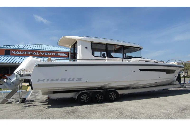  Yacht Photos Pics 2025 Nimbus Commuter 11 boat on trailer at Nautical Ventures dealership.