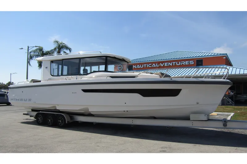  Yacht Photos Pics 2025 Nimbus Commuter 11 boat on trailer at Nautical Ventures dealership.