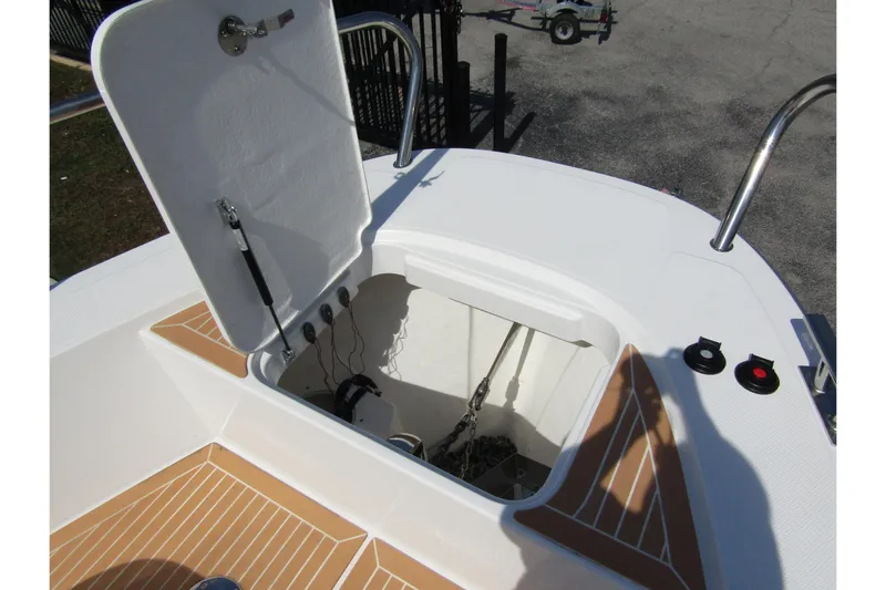  Yacht Photos Pics Open hatch on 2025 Nimbus Commuter 11 boat, showing interior storage compartment.