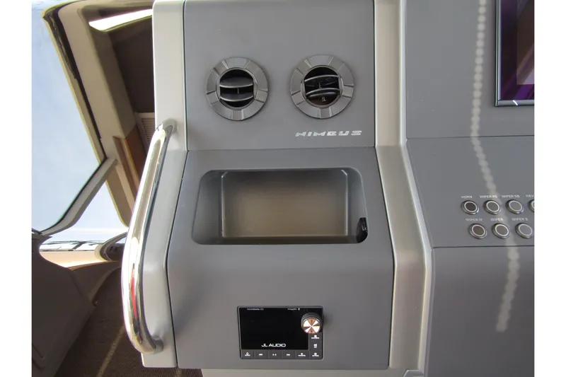  Yacht Photos Pics Control panel of 2025 Nimbus Commuter 11 with air vents and audio system.