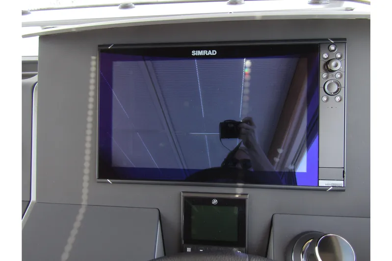  Yacht Photos Pics Dashboard of 2025 Nimbus Commuter 11 with Simrad display and controls.