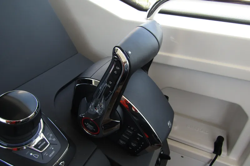  Yacht Photos Pics Control panel of 2025 Nimbus Commuter 11 boat, featuring modern joystick and throttle.