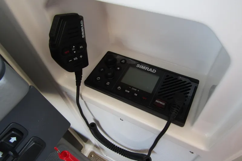  Yacht Photos Pics Simrad radio system in 2025 Nimbus Commuter 11 boat, featuring microphone and control panel.