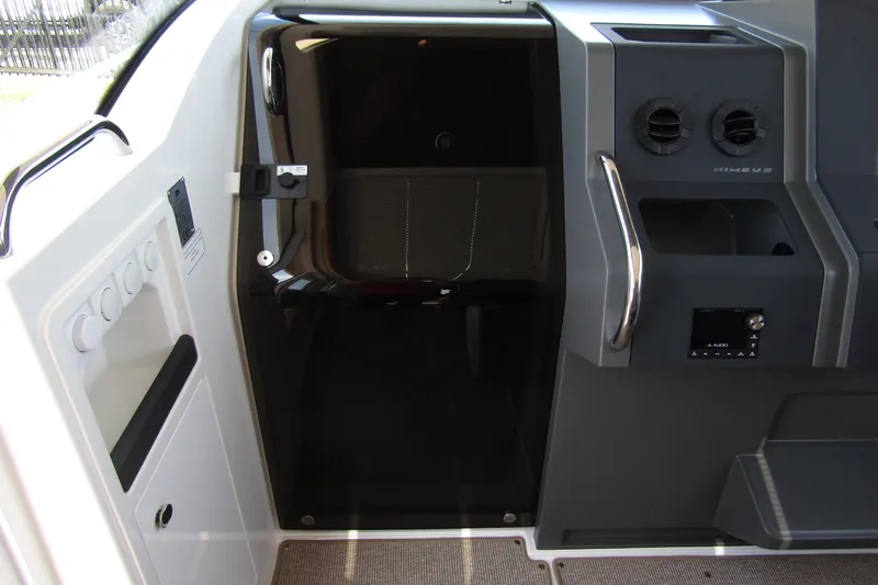  Yacht Photos Pics Interior view of 2025 Nimbus Commuter 11 boat, featuring sleek controls and modern design.