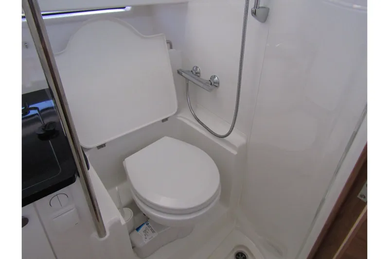  Yacht Photos Pics Compact bathroom in 2025 Nimbus Commuter 11 with toilet and shower.