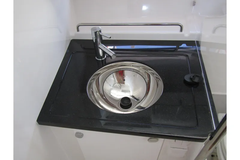  Yacht Photos Pics Stainless steel sink with modern faucet in 2025 Nimbus Commuter 11 boat.