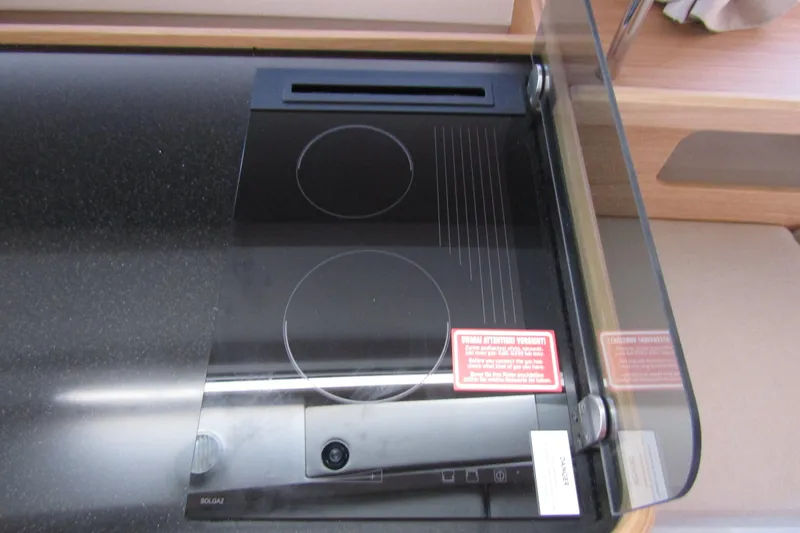  Yacht Photos Pics Modern induction cooktop in Nimbus Commuter 11, 2025 model, with glass cover.