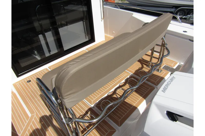  Yacht Photos Pics 2025 Nimbus Commuter 11 boat seating with stainless steel frame and teak flooring.