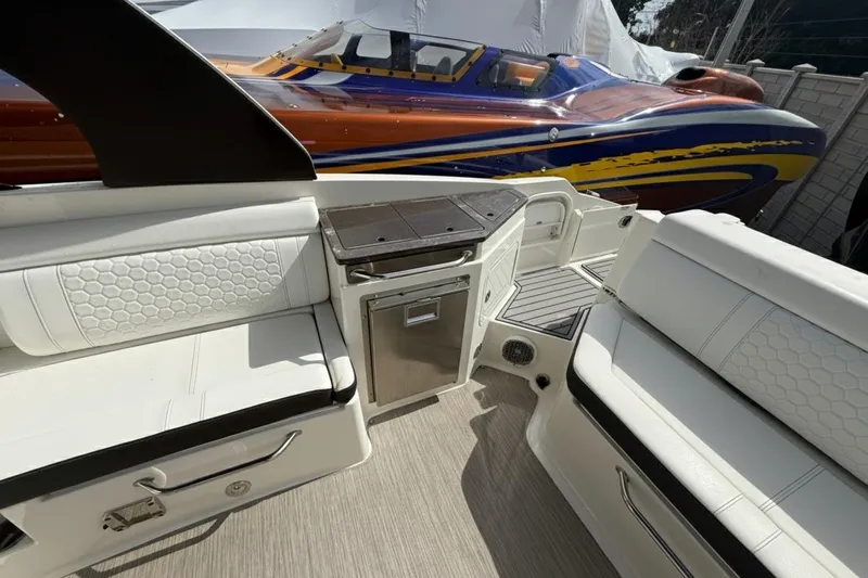  Yacht Photos Pics 2018 Sea Ray SDX 290 Outboard interior with white seating and sleek design.