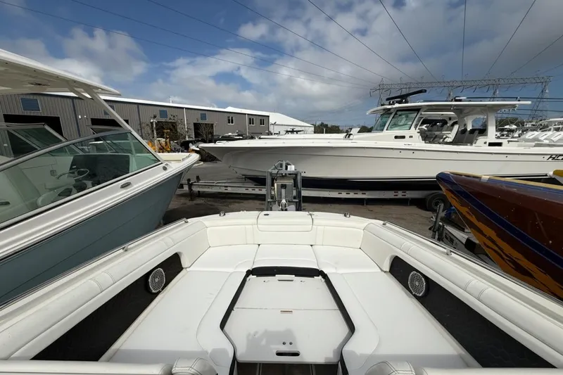  Yacht Photos Pics 2018 Sea Ray SDX 290 Outboard boat in a marina, surrounded by other vessels.