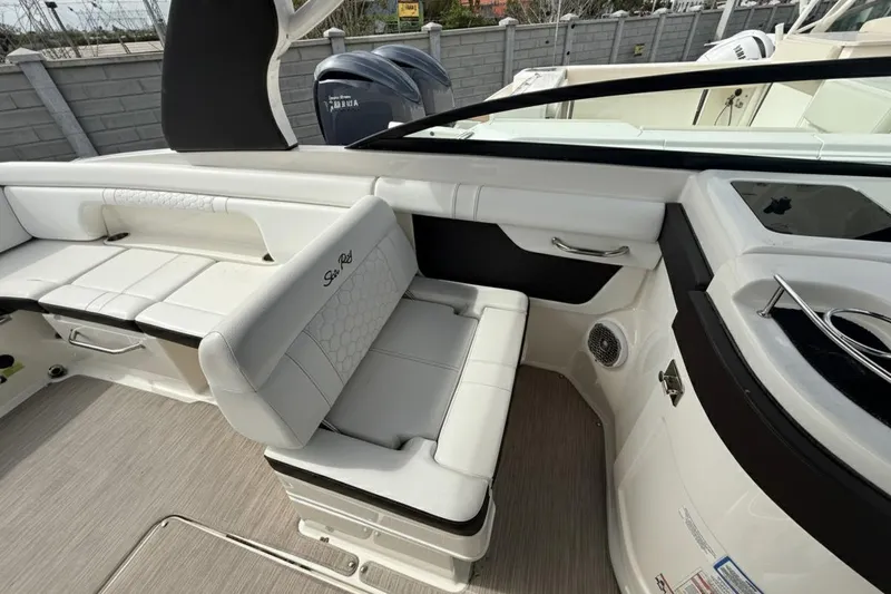  Yacht Photos Pics 2018 Sea Ray SDX 290 Outboard interior with white seating and modern design.