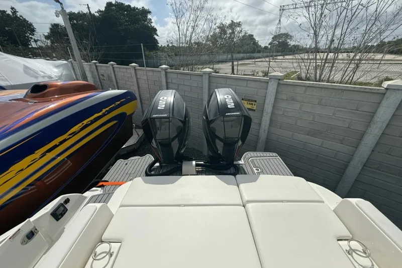  Yacht Photos Pics 2018 Sea Ray SDX 290 Outboard with dual Mercury engines, docked beside a colorful boat.