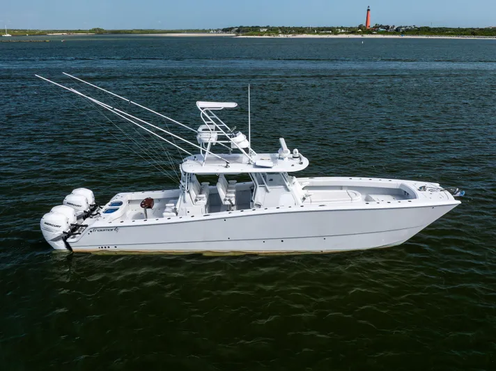  Yacht Photos Pics 2023 Freeman 42 LR boat on water with fishing rods and outboard motors.