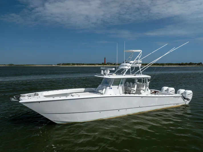  Yacht Photos Pics 2023 Freeman 42 LR boat on calm water under a clear sky.