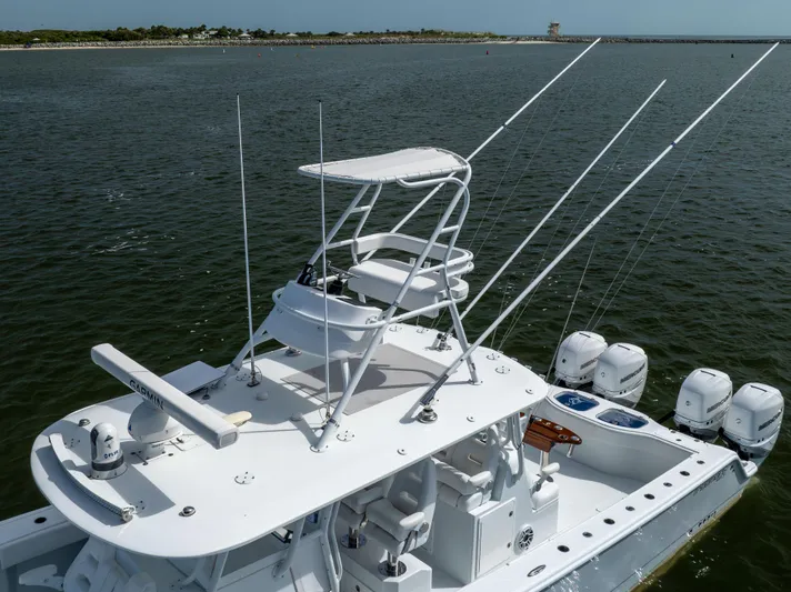  Yacht Photos Pics 2023 Freeman 42 LR boat with multiple outboard motors on open water.