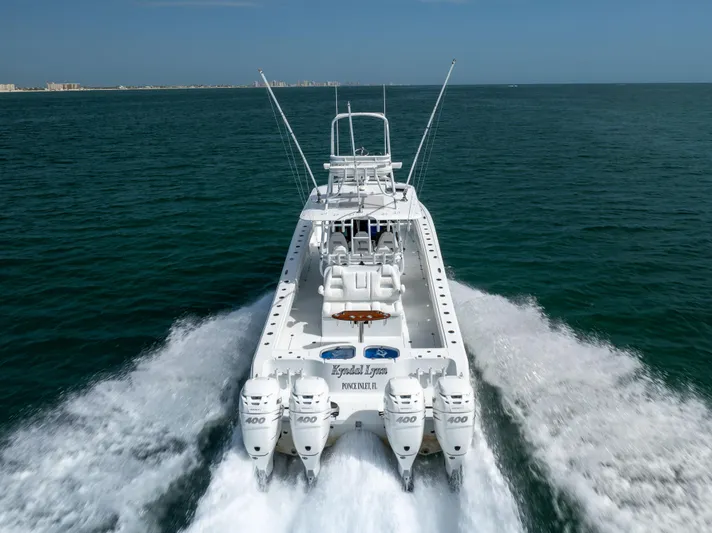  Yacht Photos Pics 2023 Freeman 42 LR boat cruising on open water with four powerful engines.