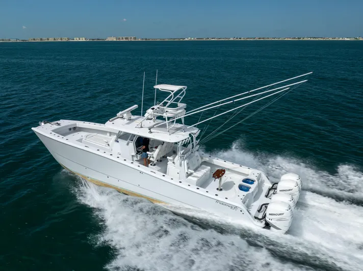  Yacht Photos Pics 2023 Freeman 42 LR boat cruising on open water with powerful Mercury engines.