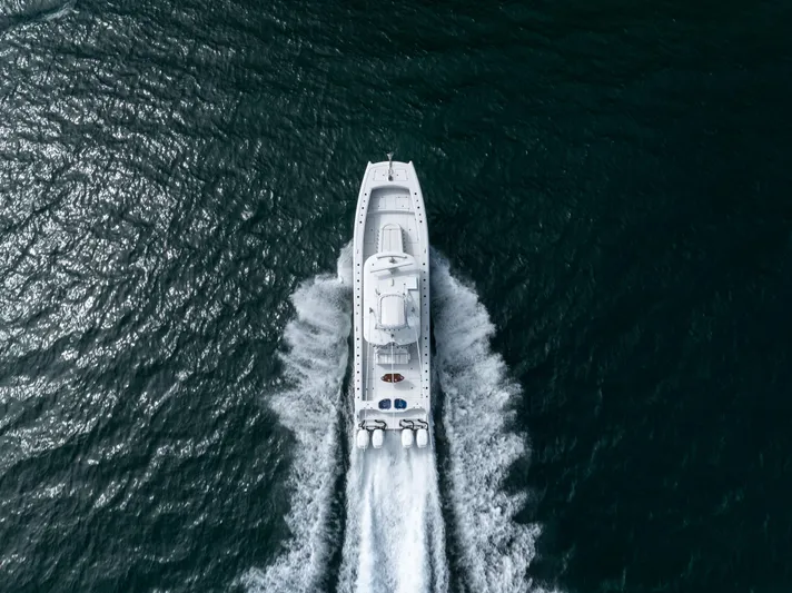  Yacht Photos Pics Aerial view of 2023 Freeman 42 LR boat cruising on open water.