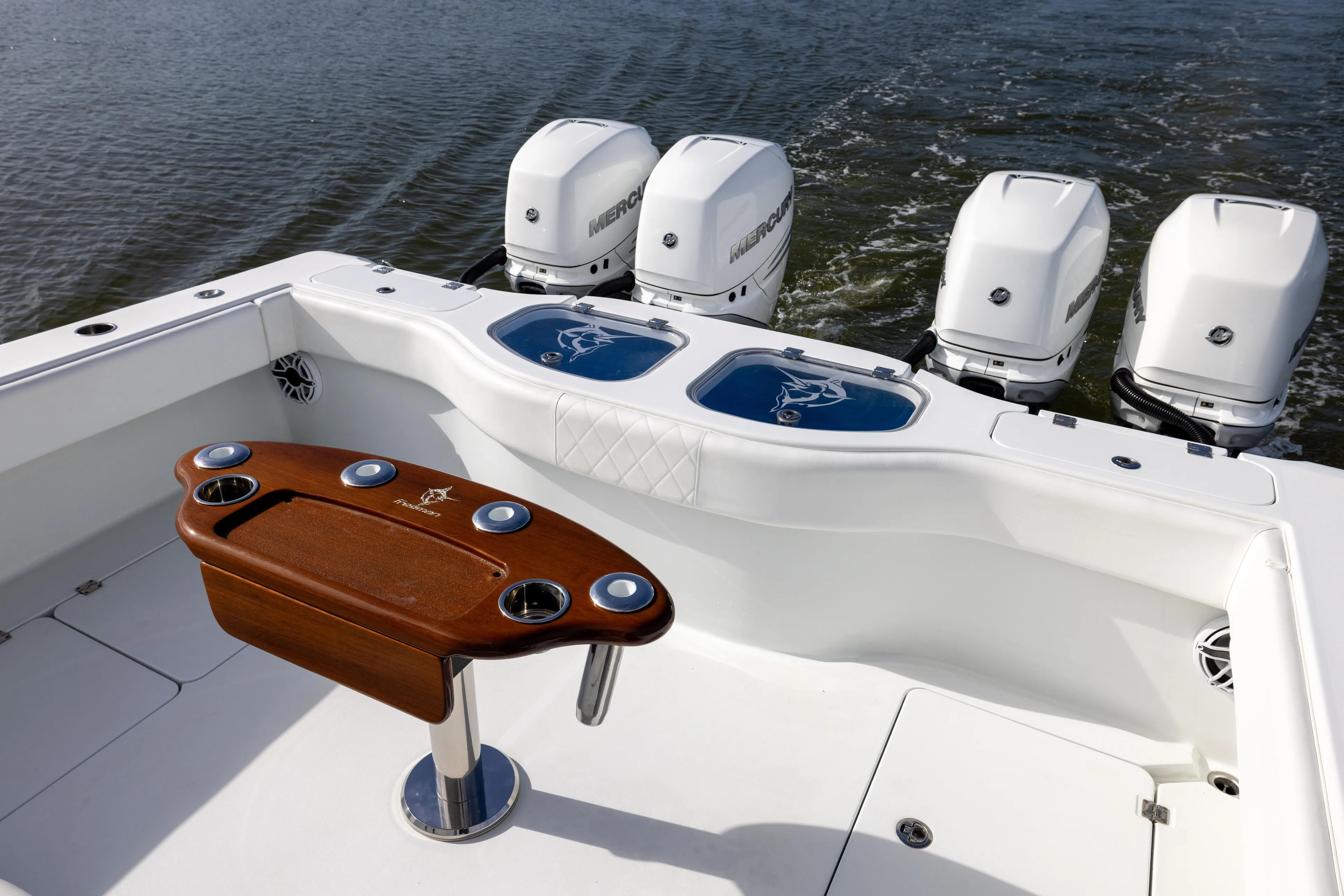  Yacht Photos Pics Freeman 42 LR 2023 boat with four Mercury outboard engines and a wooden fishing station.
