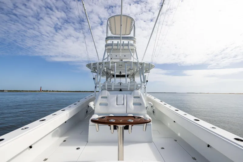  Yacht Photos Pics 2023 Freeman 42 LR boat on calm water under a partly cloudy sky.