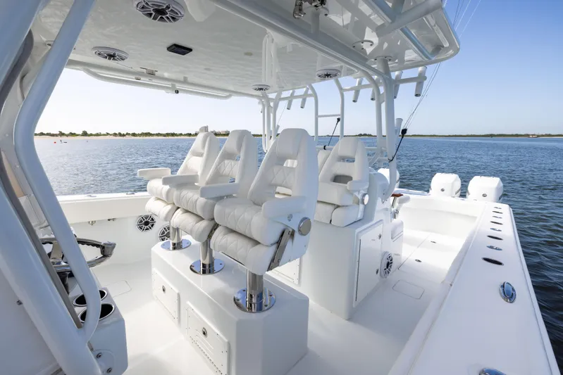  Yacht Photos Pics 2023 Freeman 42 LR boat interior with luxurious seating on a calm water backdrop.
