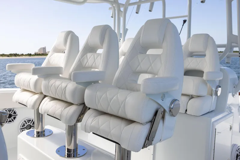 Yacht Photos Pics Luxurious white leather seats on a 2023 Freeman 42 LR boat, featuring elegant stitching.