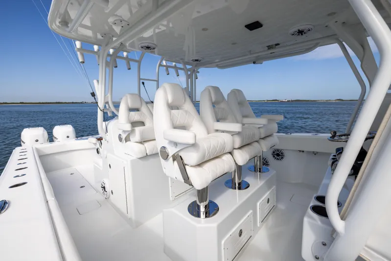  Yacht Photos Pics 2023 Freeman 42 LR boat interior with luxurious white seating and ocean backdrop.