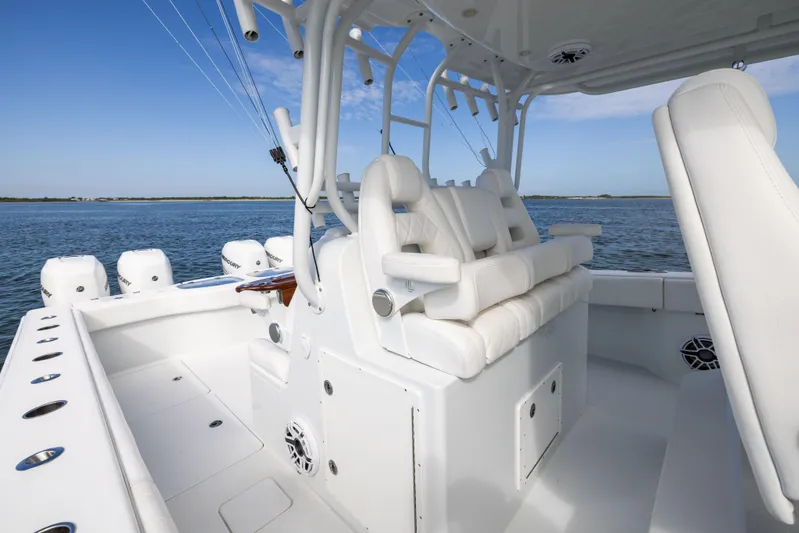  Yacht Photos Pics 2023 Freeman 42 LR boat interior with white seating and multiple outboard engines.