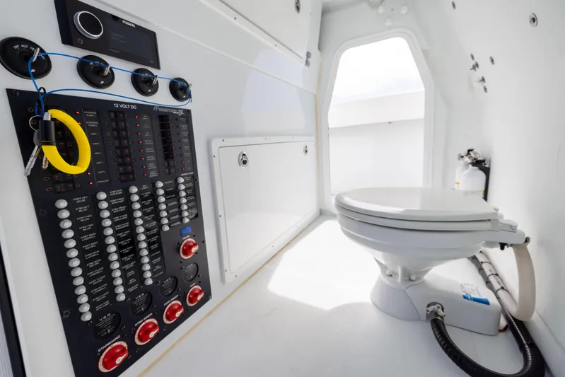 Yacht Photos Pics 2023 Freeman 42 LR boat interior with control panel and marine toilet.