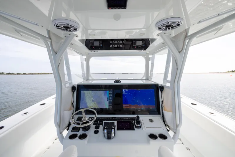  Yacht Photos Pics 2023 Freeman 42 LR boat cockpit with advanced navigation system and steering wheel.