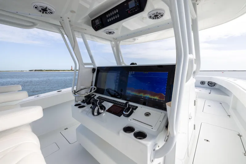  Yacht Photos Pics Modern helm of 2023 Freeman 42 LR boat with advanced navigation systems.