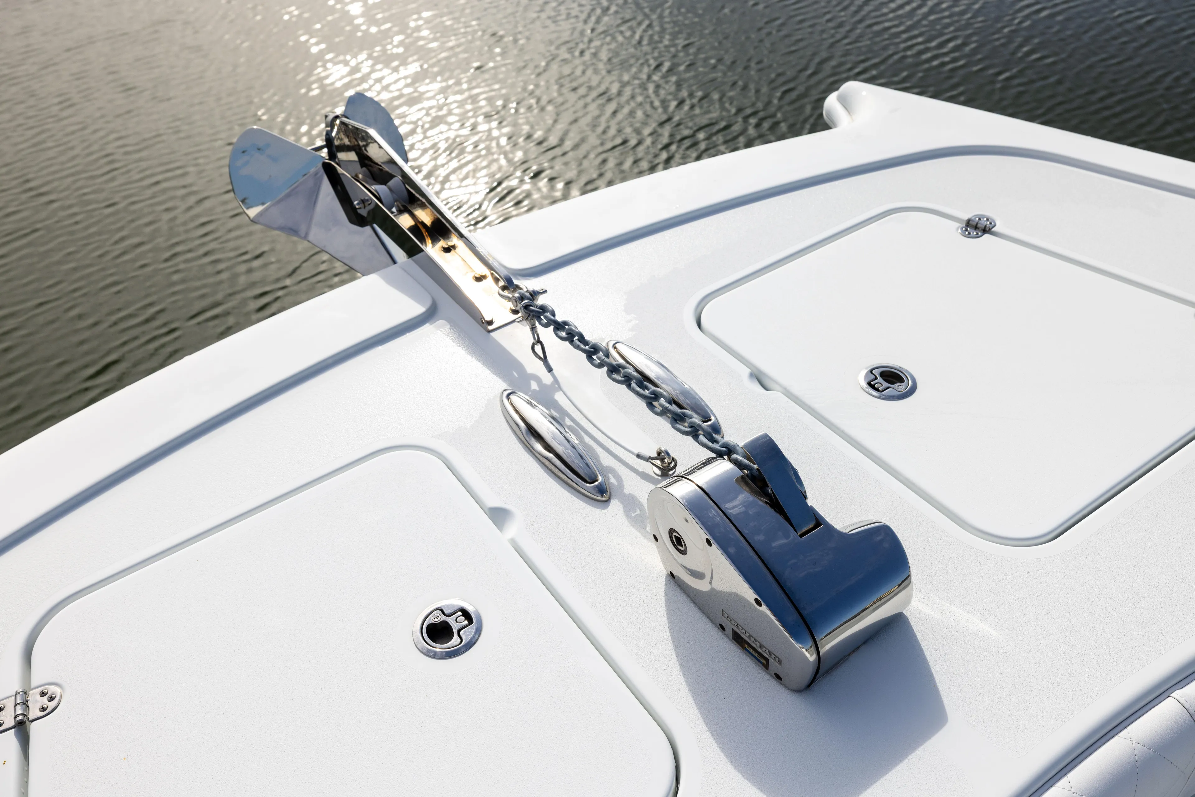  Yacht Photos Pics 2023 Freeman 42 LR boat anchor system on deck, near water.