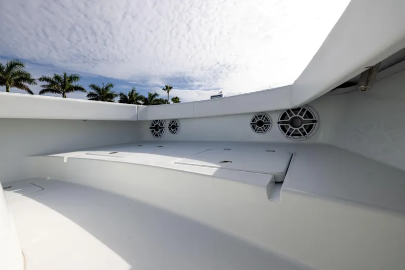  Yacht Photos Pics 2023 Freeman 42 LR boat interior with speakers, under a cloudy sky and palm trees.