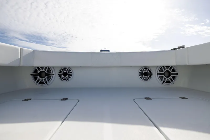  Yacht Photos Pics 2023 Freeman 42 LR boat deck with speakers under a cloudy sky.