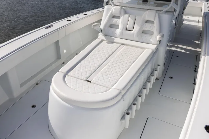  Yacht Photos Pics Luxurious seating on 2023 Freeman 42 LR boat, featuring white quilted upholstery.