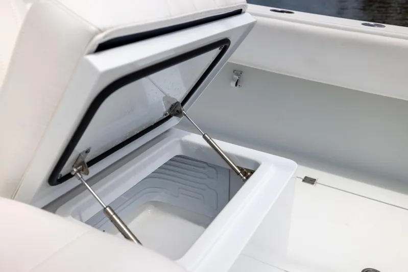  Yacht Photos Pics Open storage compartment on 2023 Freeman 42 LR boat, showcasing interior details.
