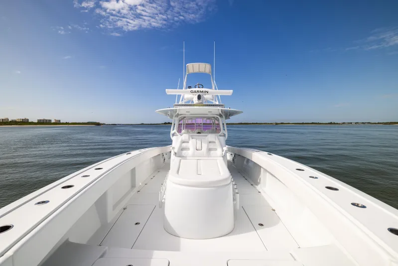  Yacht Photos Pics 2023 Freeman 42 LR boat on calm water under clear blue sky.